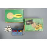 Two packs of vintage Dunlop Warwick golf balls, a small leather wallet of painted wooden tees and