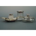Two early 20th Century silver-covered glass dressing table jars together with an electroplate and