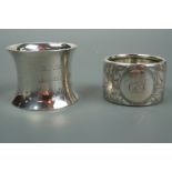 Two Victorian silver napkin rings, one, of waisted form engraved "E L W H A, Jan 23rd 1900 from