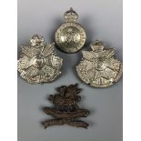 An 11th (Lonsdale) Battalion Officer's Service Dress cap badge together with 4th and 5th Battalion