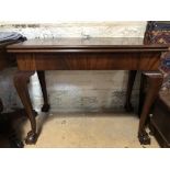 A fine Victorian mahogany turn-over-top tea table, having slender cabriole legs with claw and ball