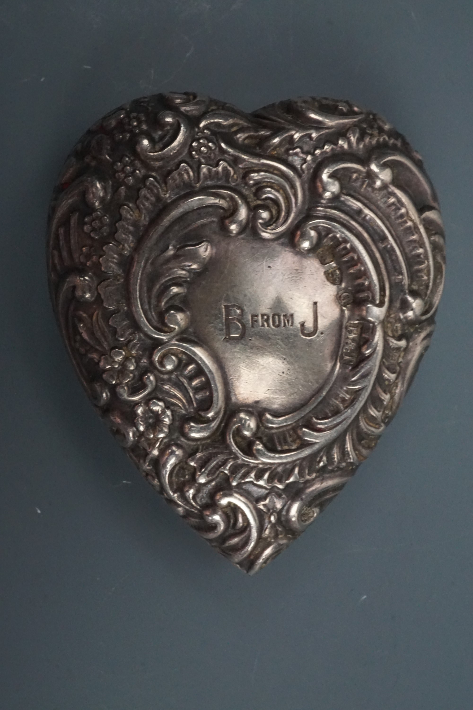 A late Victorian silver heart-shaped patch or similar box, each face relief-decorated in a rococo - Image 2 of 3