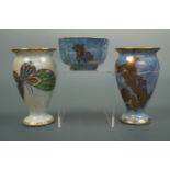 Two Wedgwood lustre small oviform footed vases and an octagonal bowl, variously decorated in