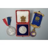 A cased 1902 coronation commemorative medallion, a George VI example, a lodge medallion and a Lutton