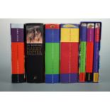 Four J K Rowling first edition Harry Potter novels together with a set of three in slip-case