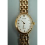 A 1990s lady's Accurist 9 ct gold quartz wristwatch, having an integral flexible bracelet strap,