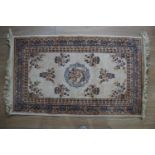 An oriental rug, 110 cm x 70 cm