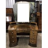 A 1930s Art Deco walnut dressing table and tallboy