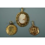 A 9 ct gold mounted shell cameo pendant together with a 9 ct gold cherub pendant and a yellow