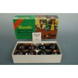 A boxed set of vintage Henselite carpet bowls