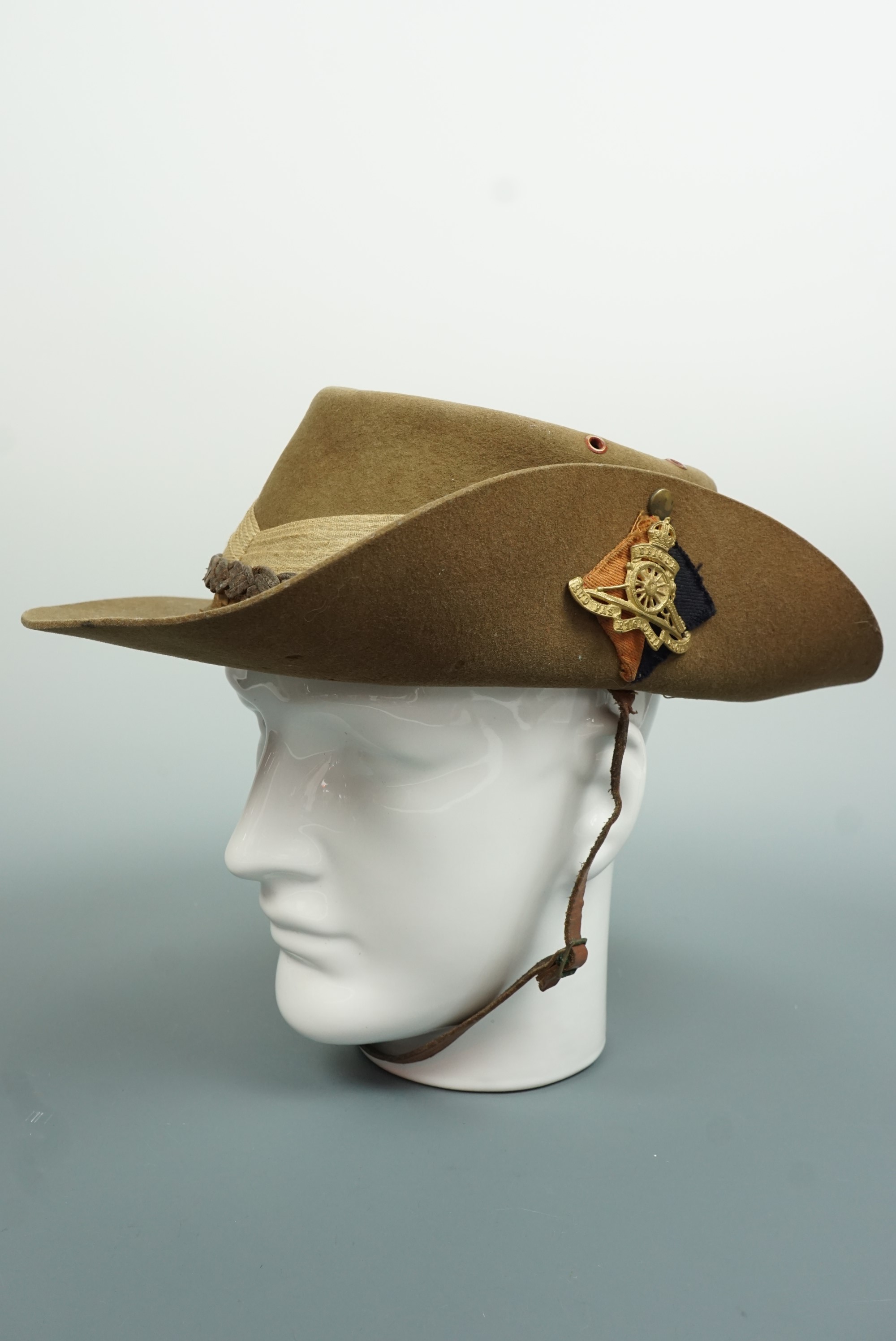 A Second World War British army bush / slouch hat, bearing a Royal artillery badge and backing,