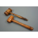 An antique Jerusalem turned olive wood gavel together with a gavel with lignum vitae head, former 23