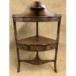 A reproduction George III mahogany corner wash stand