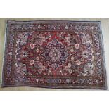 An Iranian rug, 165 cm x 110 cm