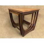 A 1960s teak nest of tables