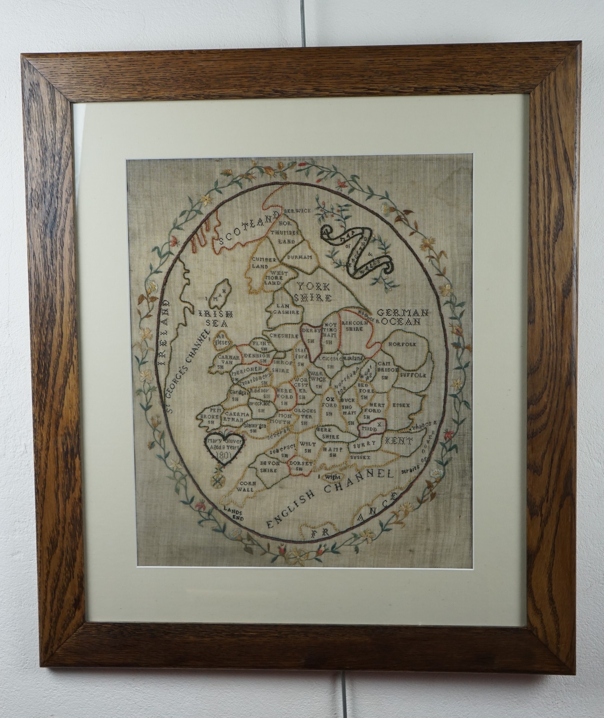A Georgian needlework sampler map of England and Wales being the work of Mary Glover, aged 8,