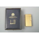 A gold plated Dunhill 70 cigarette lighter, cased with instructions