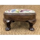 A 1930s oak circular pad stool having short cabriole legs