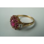 A contemporary ruby and diamond dress ring, in a flower head cluster arrangement with pairs of