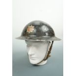 A 1939 steel helmet bearing a North Riding fire brigade decal