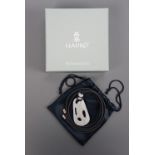 A Lladro Talismania Monkey pendant necklace, No. 01010037, released 2005 and retired 2010, in