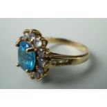 A contemporary Swiss blue topaz, tanzanite and yellow beryl dress ring, in a flower head cluster