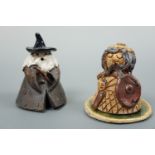 A craft pottery candle dousers modelled as a wizard and one other, 8 cm high