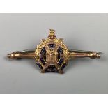 A King's Own Scottish Borderers enamelled yellow metal sweetheart brooch, (stamped 9 ct and tested