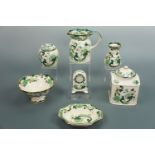 Seven items of Mason's Chartreuse ware including a ginger jar, clock, jug, bowl, vase etc.