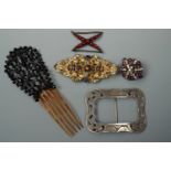 Antique dressing accessories including a jet bead mantilla-type hair comb, a paste set boss form