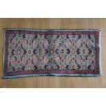 An oriental rug, 125 cm x 60 cm
