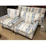 A quality three-piece suite upholstered in a banded and floral cream fabric