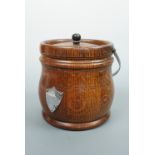 A 1930s oak biscuit barrel