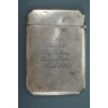 A 1920s silver visiting card case bearing the engraved inscription "See All, Say Nothing, Learn a