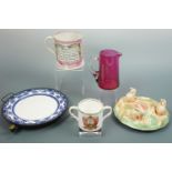 A Victorian warming plate, a Victorian "Sailor's Farewell" tankard, a cranberry glass jug and a