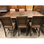 A 1940s oak draw-leaf dining table and six chairs