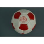A signed Manchester United football, circa 1984 - 1986 bearing team and manager autographs