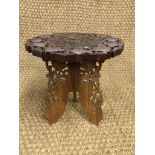 An Indian carved and inlaid plant stand, 32 cm