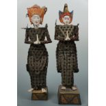 Two South Asian carved and painted wooden figures, 44 cm high