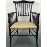 A late Victorian ebonized spindle back armchair