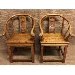 A pair of traditional Chinese armchairs