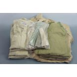 A large quantity of British army officer's tropical and other shirts, shorts, trousers, collars etc,