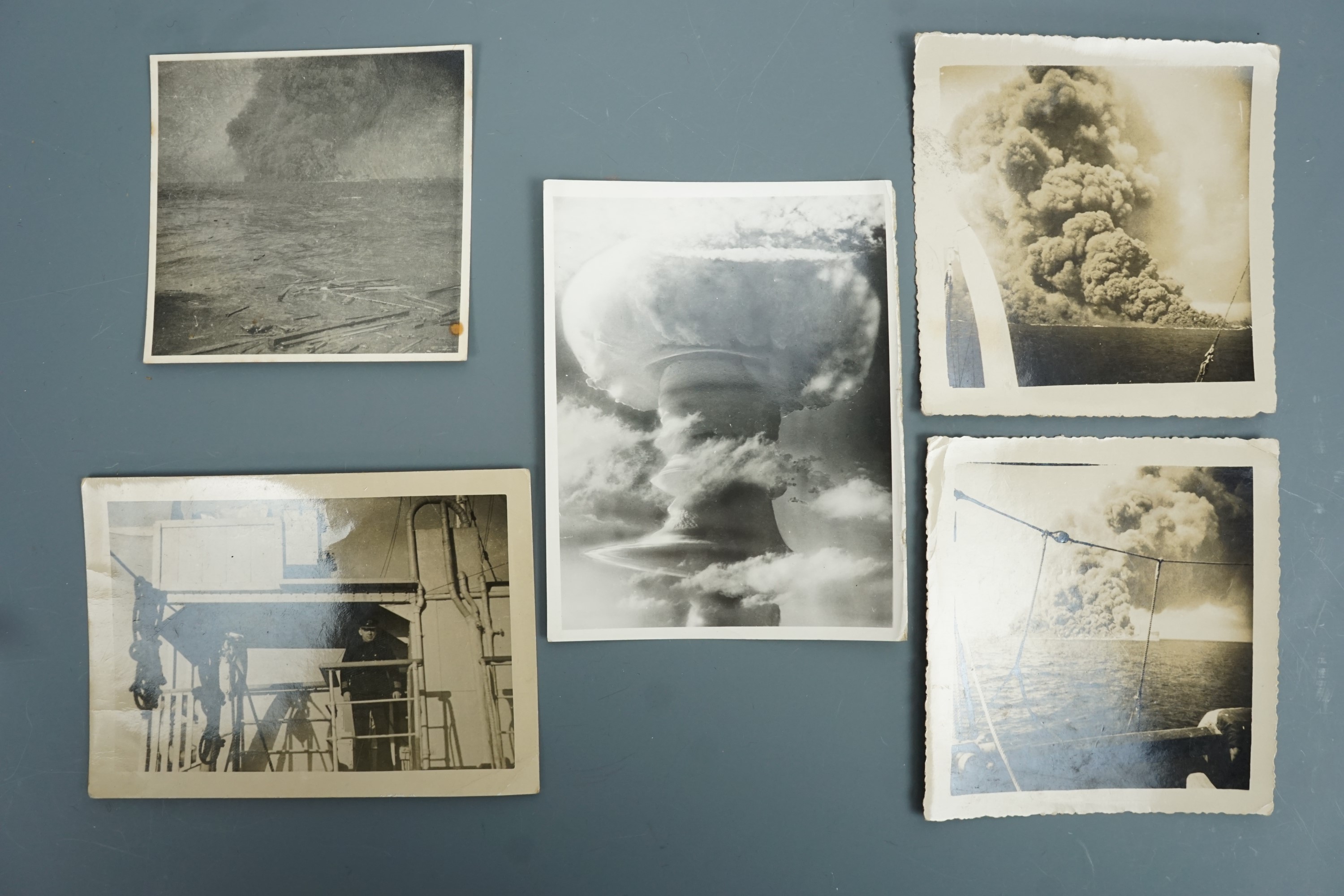 Period unofficial photographs of the sinking of the tanker Empire Gold following shelling by the