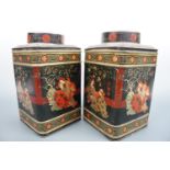 A pair of large black Japanned canisters, 29 cm