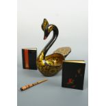 A Russian lacquered kovsh-like swan, a cigarette holder and two notebooks