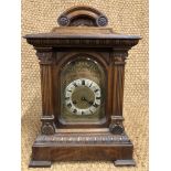 A late 19th Century Junghans walnut-cased bracket clock, having a three-train movement striking on