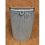 A Lloyd Loom D-section laundry basket