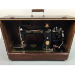 A vintage Singer table model sewing machine, no EF076039