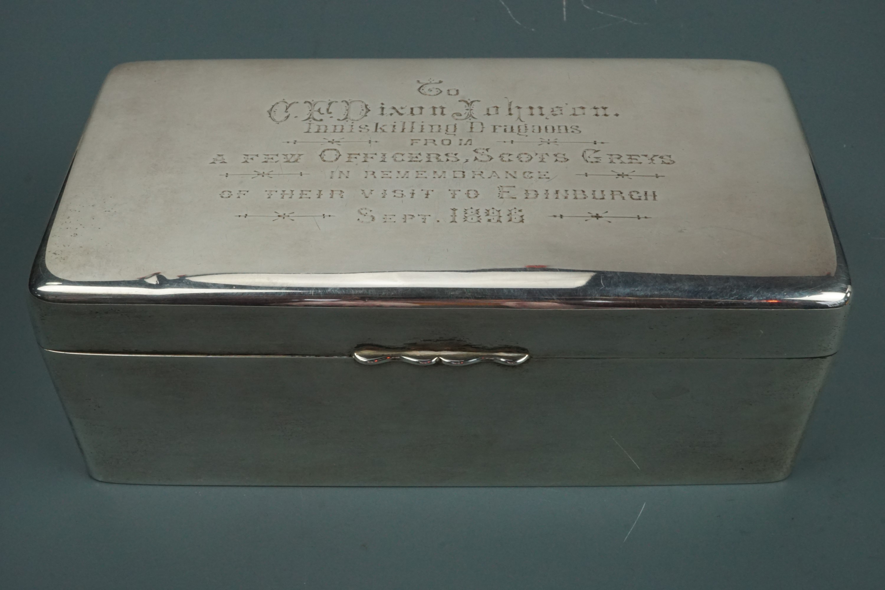 A considerable Victorian silver table cigarette box, its lid bearing an engraved presentation