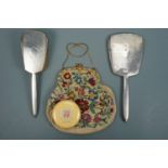 A 1930s silver-backed hand mirror and brush, a composition box and tapestry evening bag